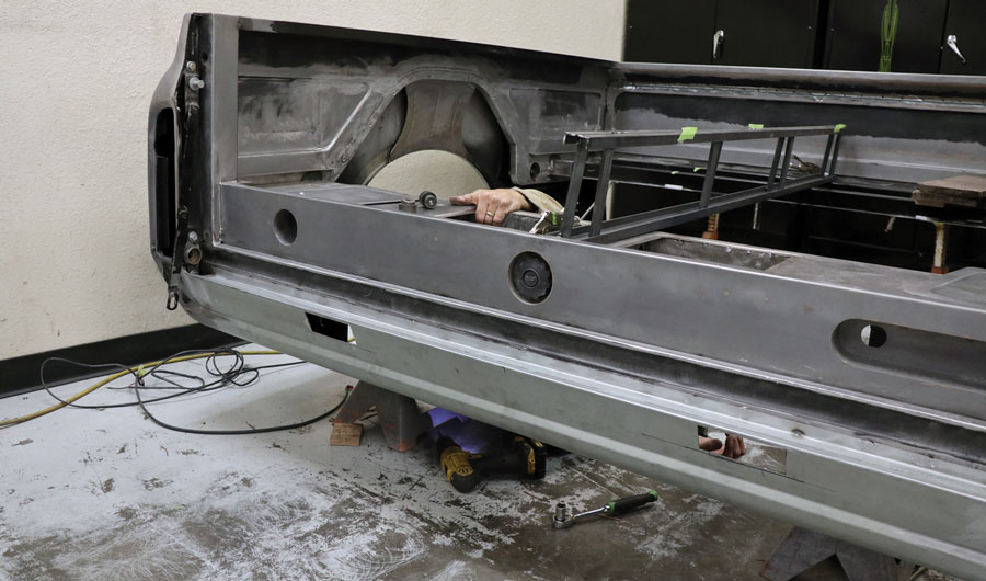 Custom pickup bed has many one-off features such as the center mounted gas filler, custom rear bumper mounting, and hidden battery trays.
