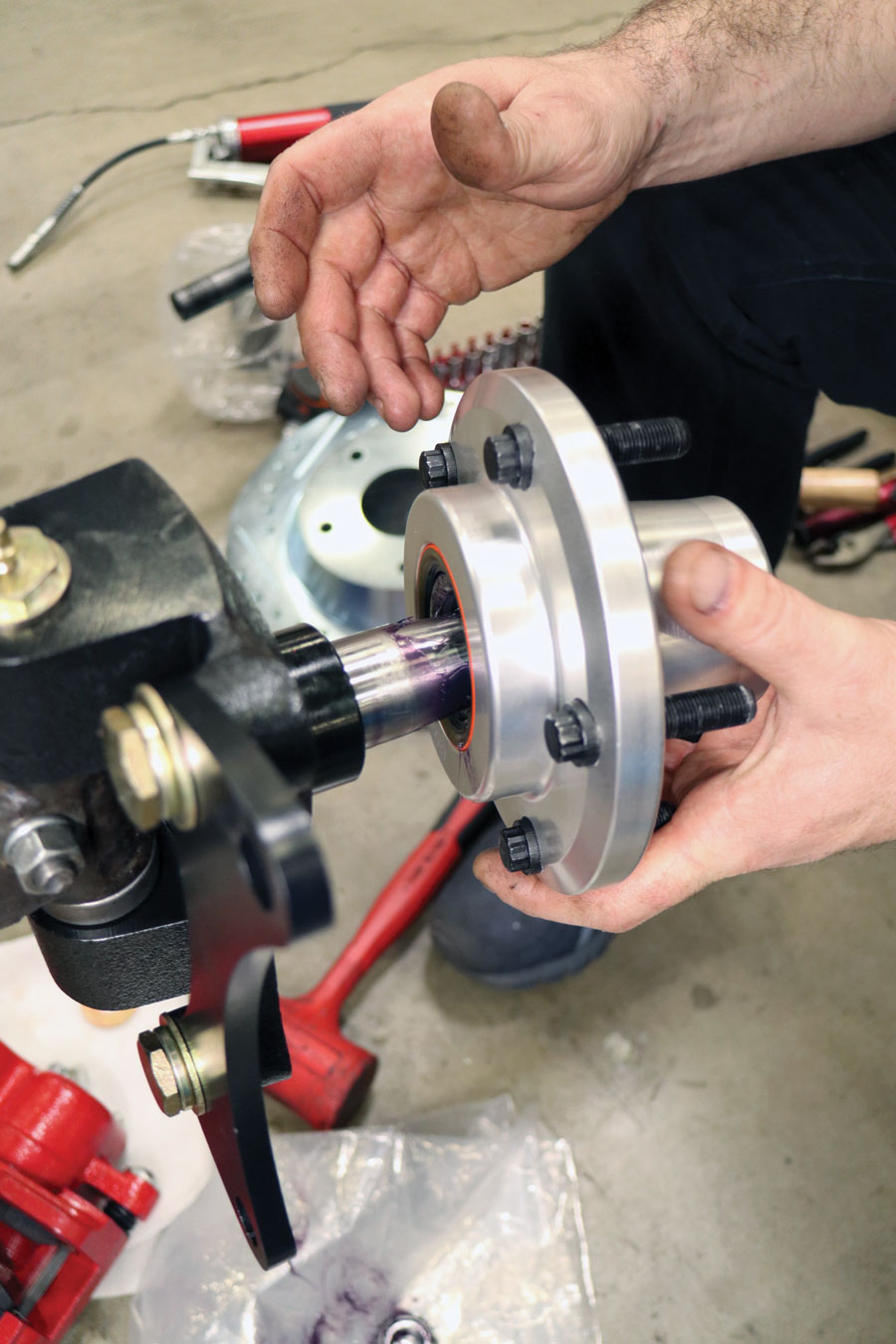 Install the hubs just as you would a one-piece rotor