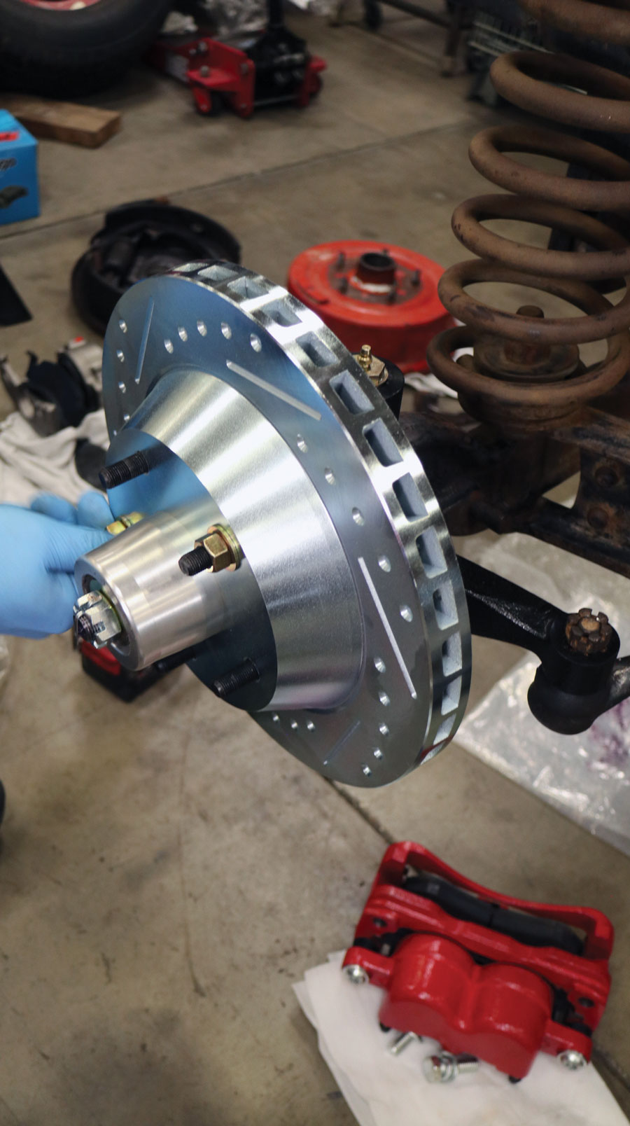 Set the new rotor onto the hub and temporarily secure with a couple lug nut