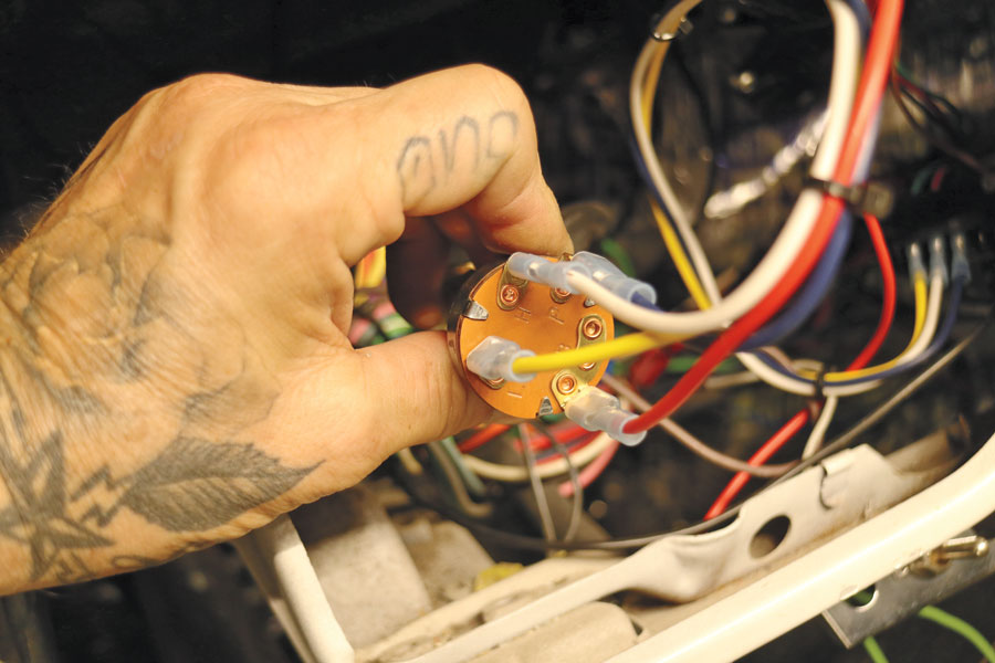 The new two-speed switch is pre-wired with the provided harness before being installed in the dash