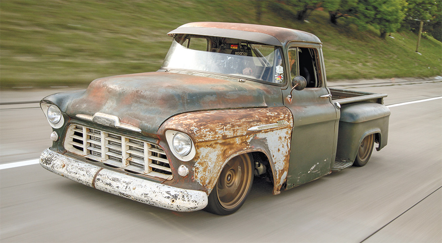 view of 1956 Chevy 3100 on the road