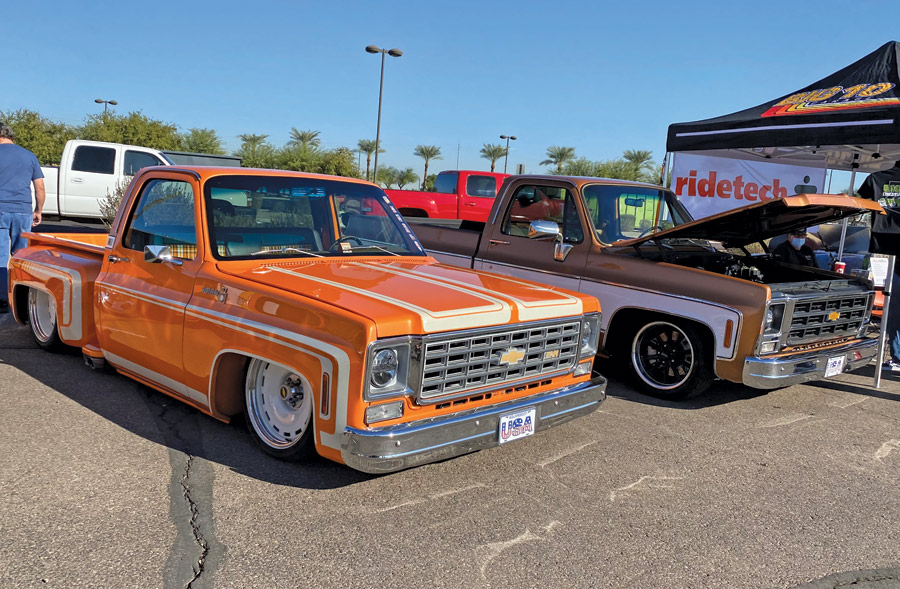 Orange and Brown Trucks at a car show