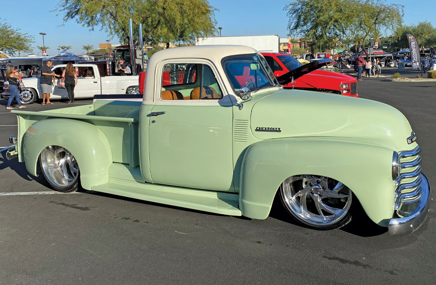 green truck at a car show