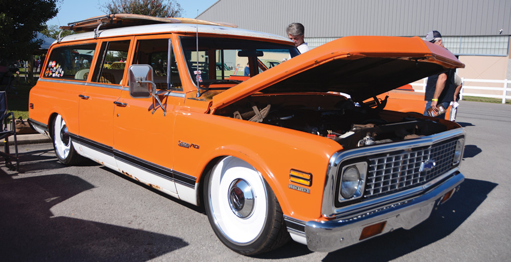 Orange Chevy wagon with hood open