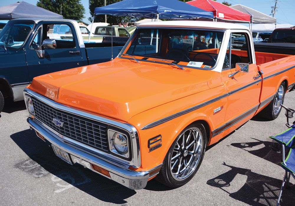 Orange two seater Chevy truck