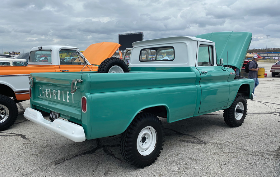 turquoise truck with hood open