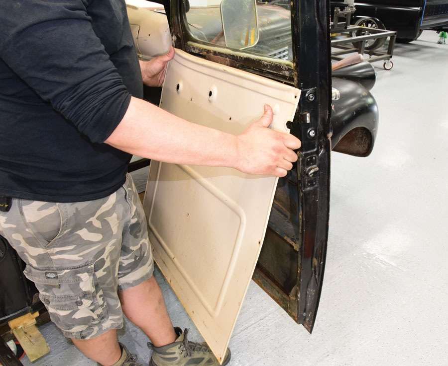 2: The inner door handle, window-riser handle, and door panel screws were removed next using the same clutch head drive