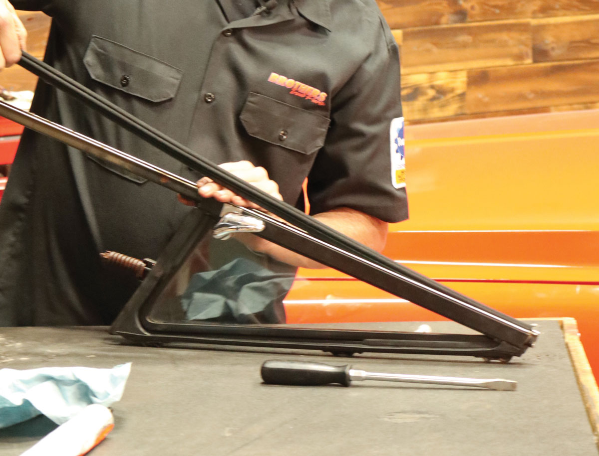 13: Carefully press the metal-embedded felt channel in place, ensuring it seats fully into the division bar