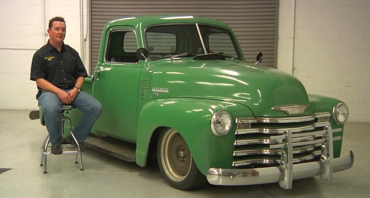 Craig Morrison pictured sitting next to a green classic truck