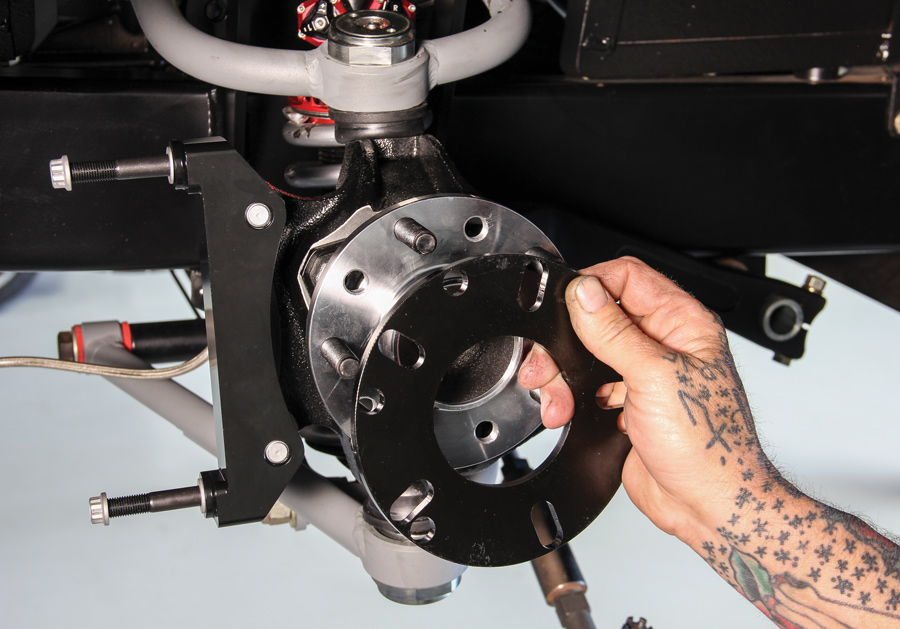 To align the rotor with the standard offset hub and caliper bracket