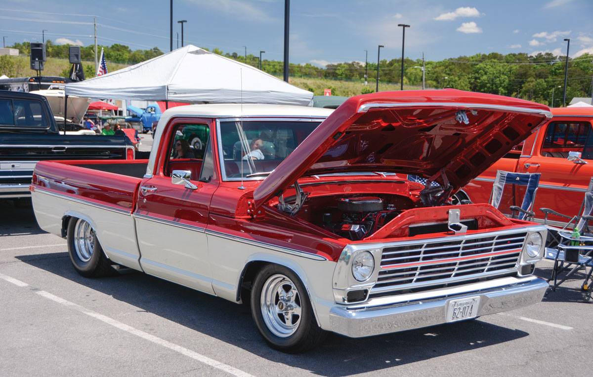 White and red F-100 with the hood up
