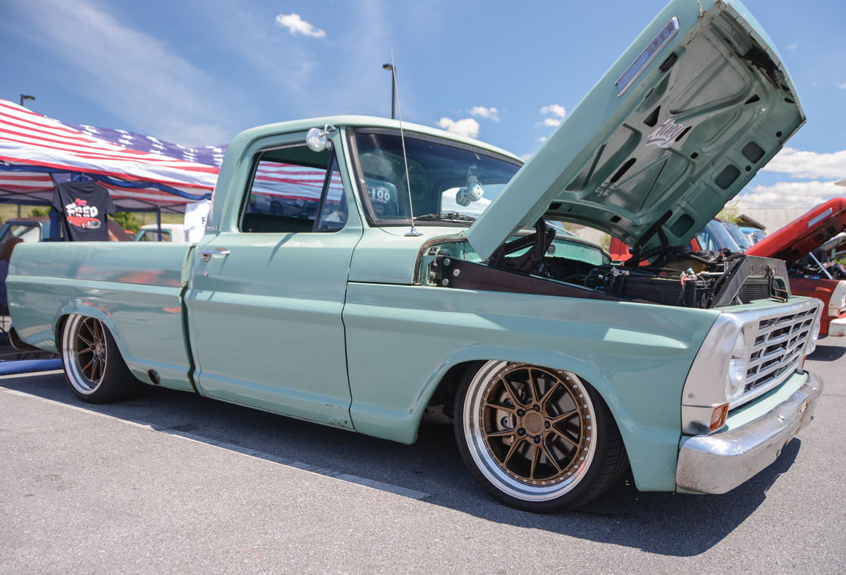Mint green F-100 outside with hood up