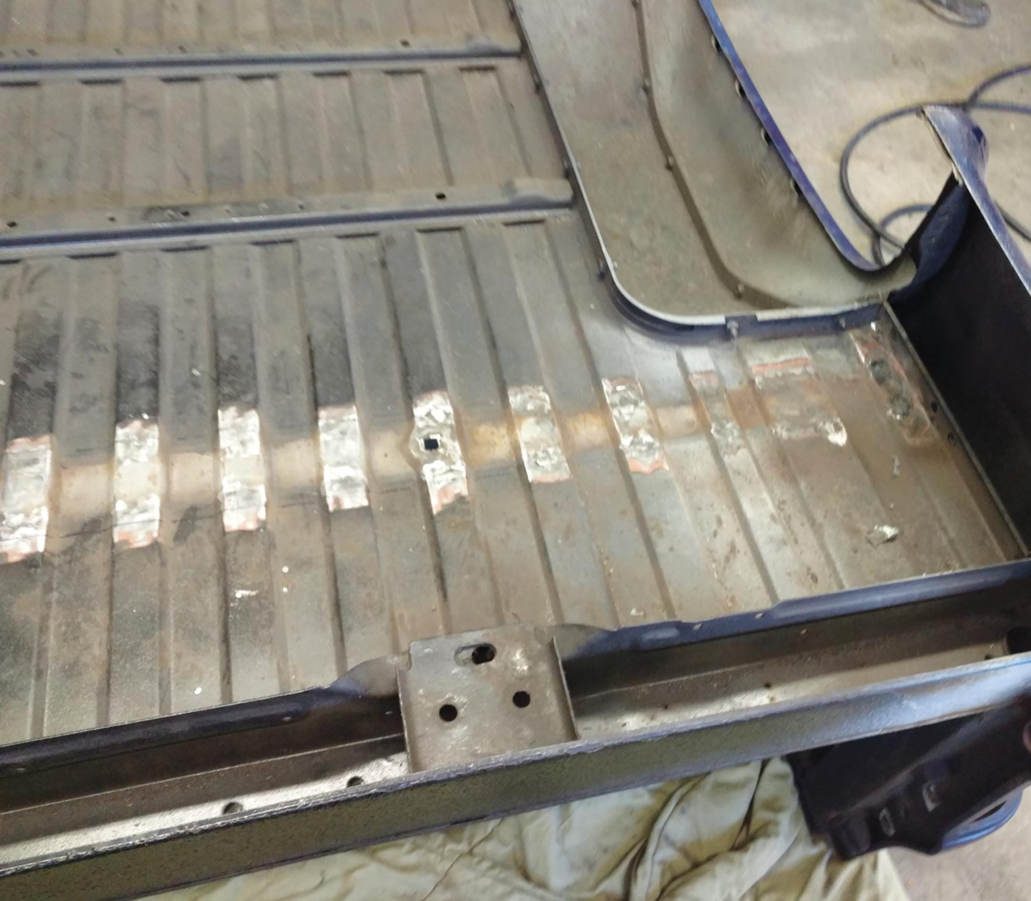 truck bed floor, stripped of old crossmembers