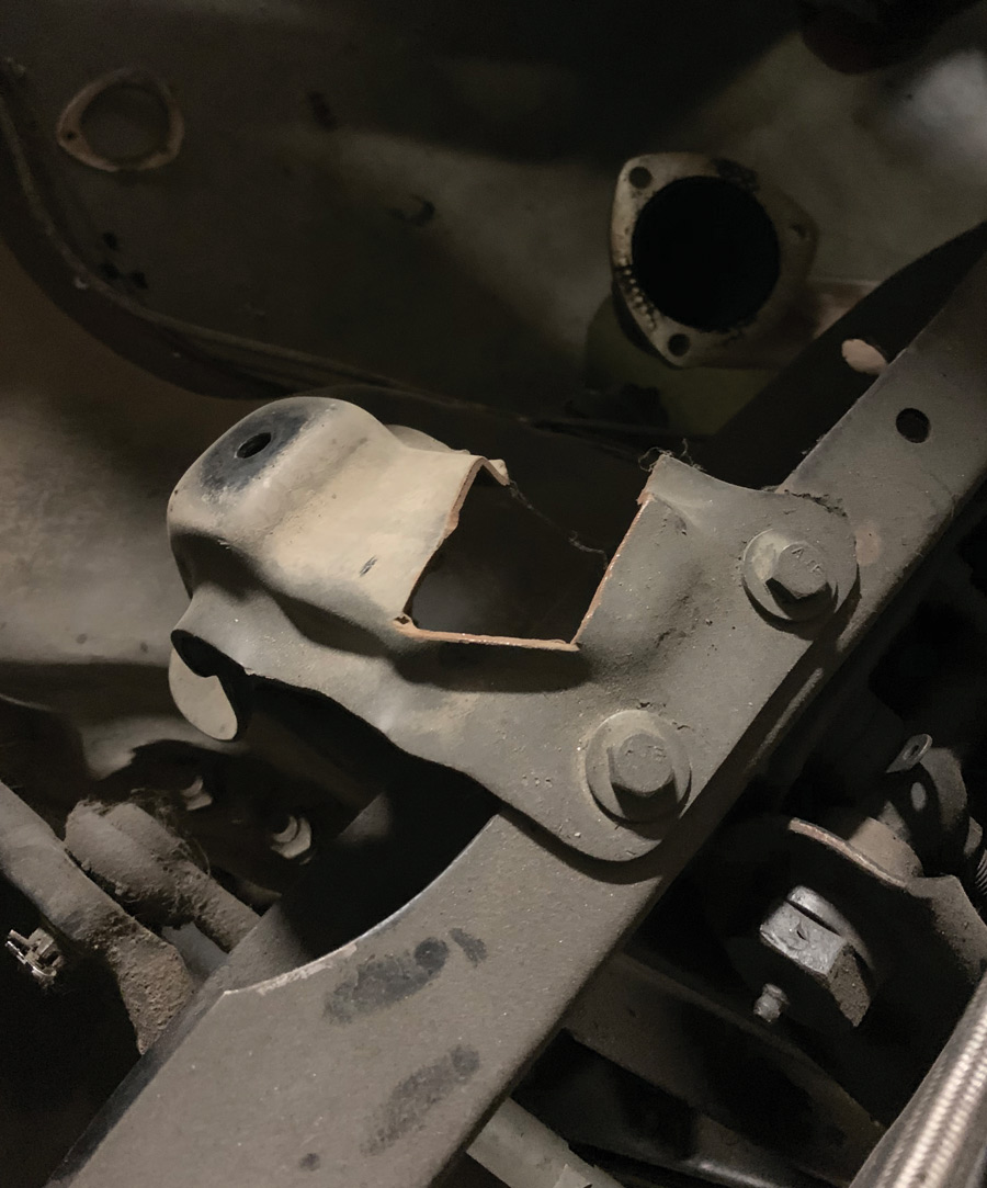 in order to provide clearance for a set of cheap mid-length headers the previous owner had installed, the driver side engine mount perch had been, um, severely compromised, to say the least