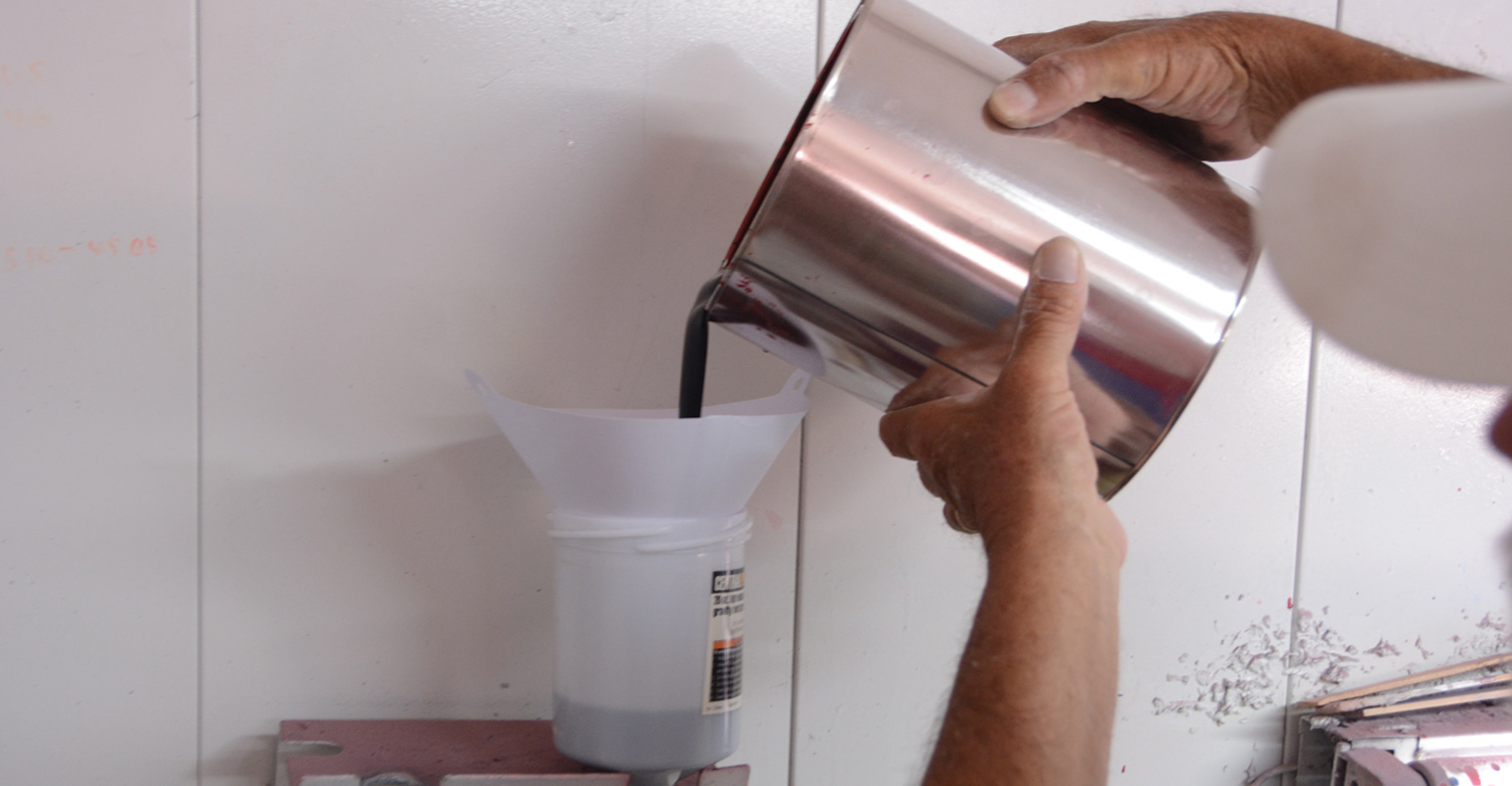 a strainer is used to keep debris out of the cup as it is poured into the paint gun