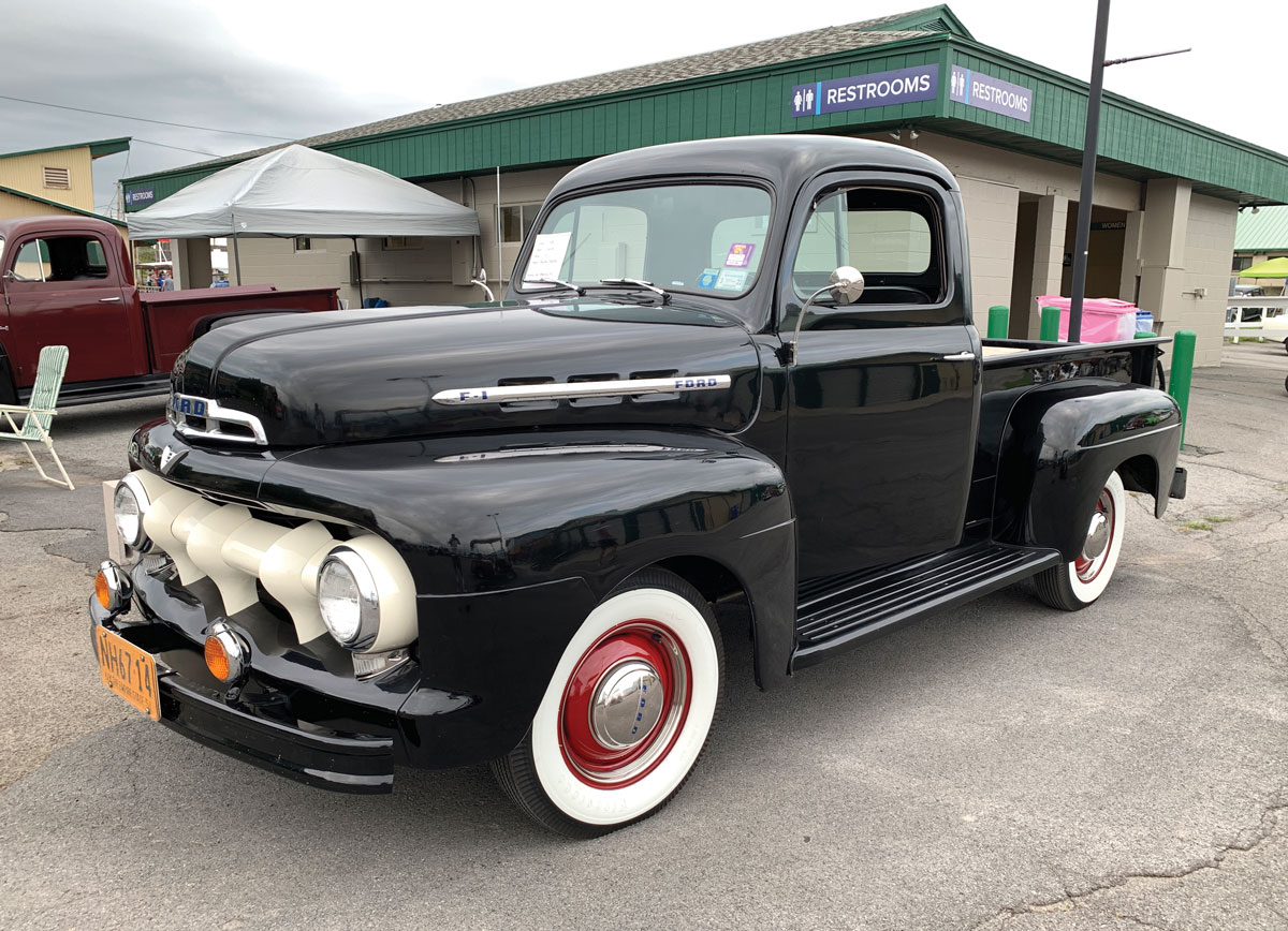 Black Ford truck with white trim