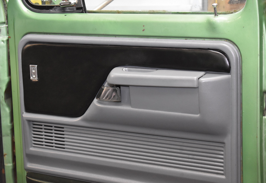 The passenger door panel uses a single switch. When we redo the interior we’ll make new inserts with pleats.