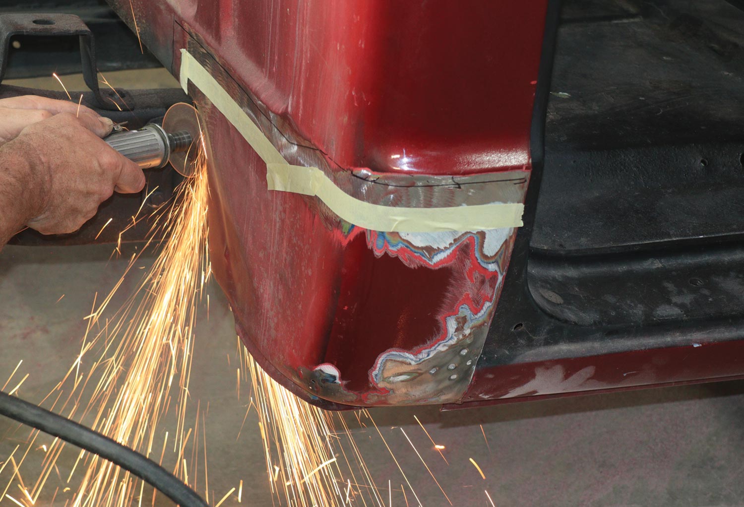 using a die-grinder with a 3-inch cutoff disc, mechanic cut open the end seams