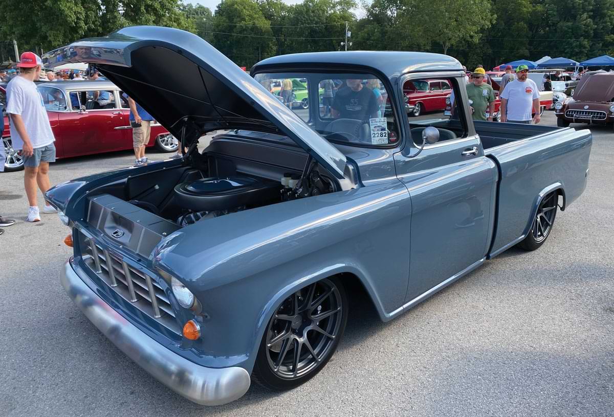 Blue truck with open hood