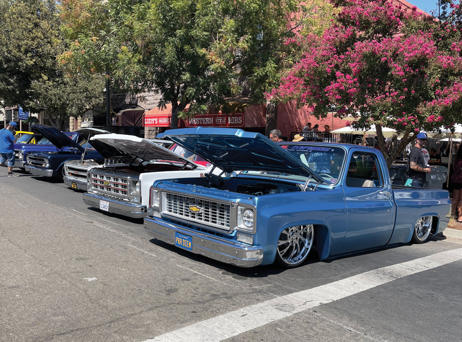 blue and white chevy trucks lowered