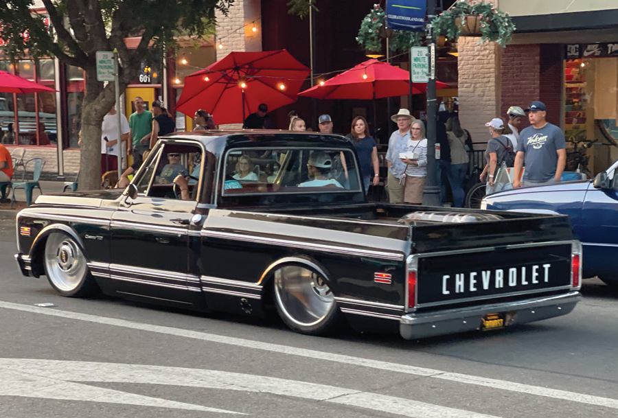 rear view of black truck with chevrolet decal letters