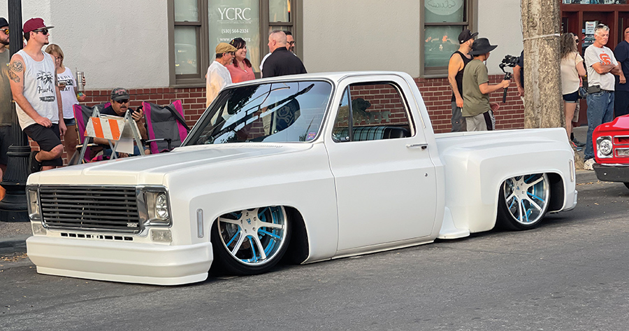 white lowered truck with blue rims