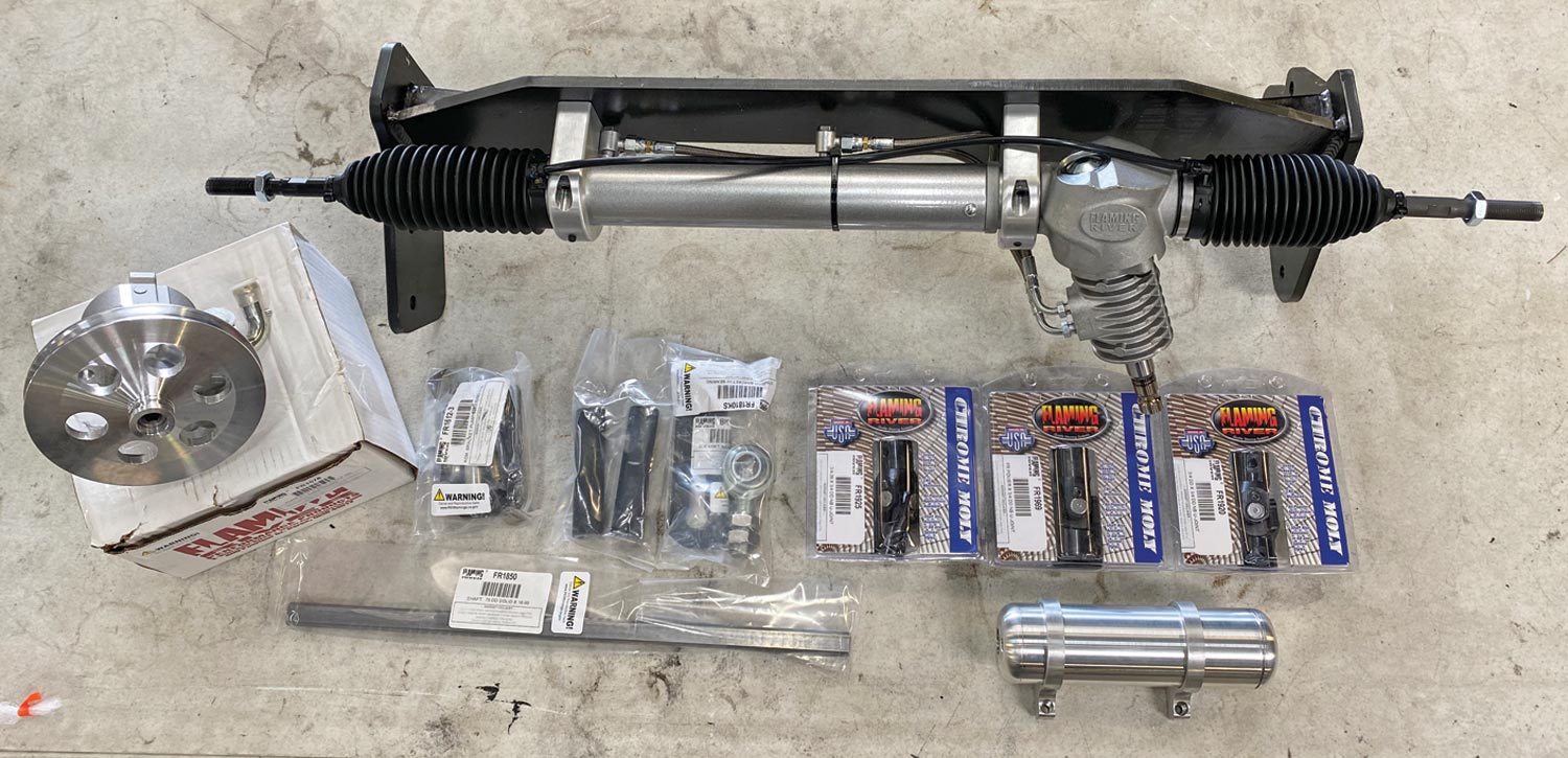 Flaming River’s billet-servo power rack (with beefy 0.98-inch steering linkage) captured in a 3/8-inch plate cradle; U-joints, intermediate shaft, and heim support; Type II pump with pulley, adjustable brack- et, and aluminum reservoir; and all necessary hardware