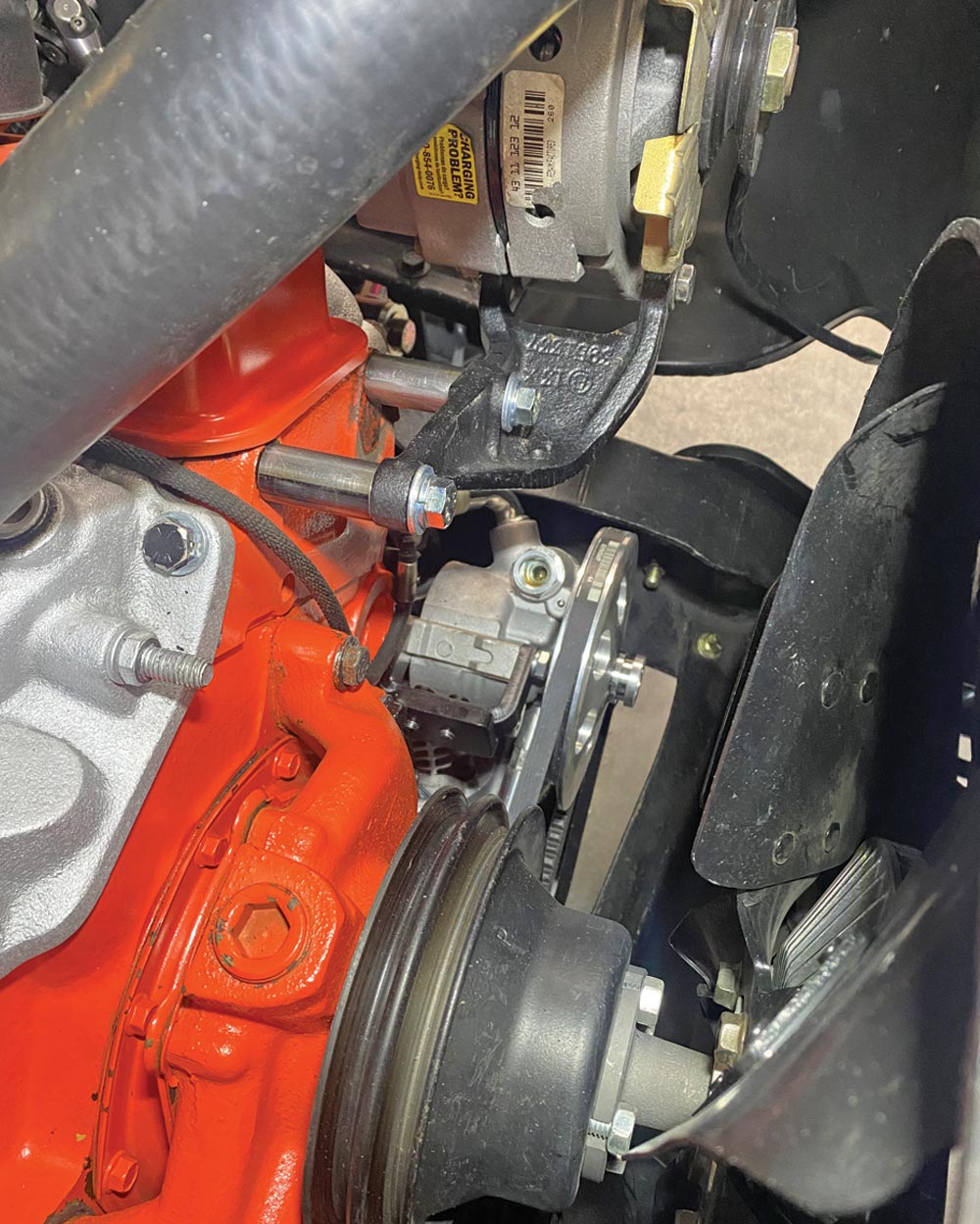 with the pump positioned tight against the block of the 350 SBC, due to the truck’s factory A/C setup and V-belt orientation, the alternator had to be reconfigured to run off the front pulley groove (both the power steering and A/C have their own dedicated  belt now)