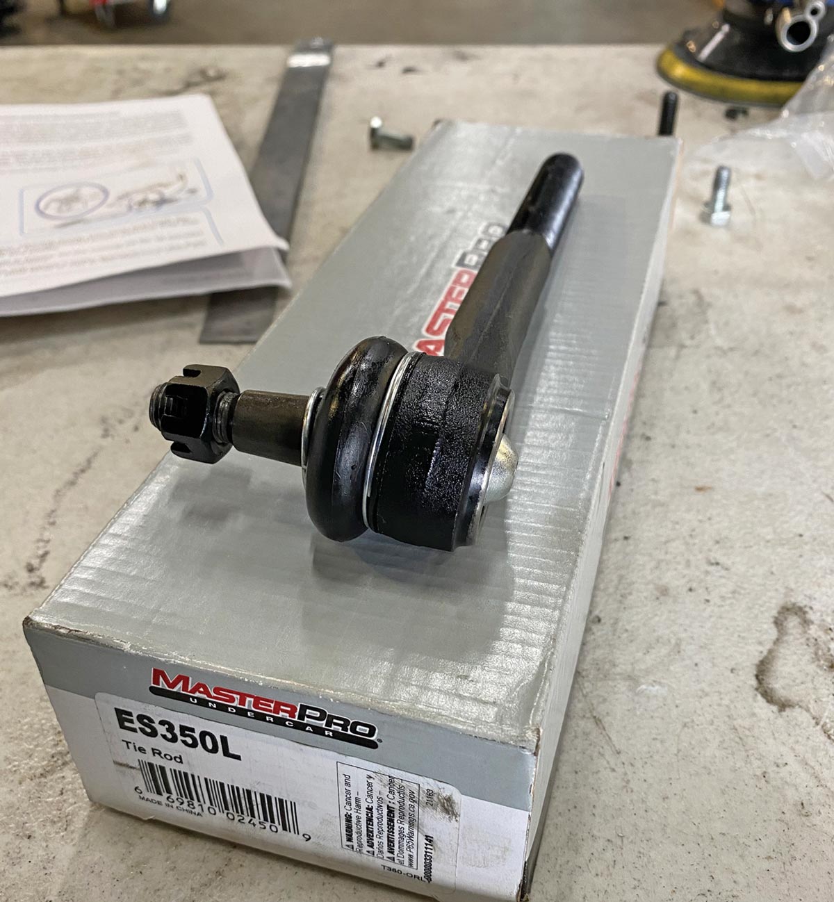 a Master Pro tie rod end sits on top of its box