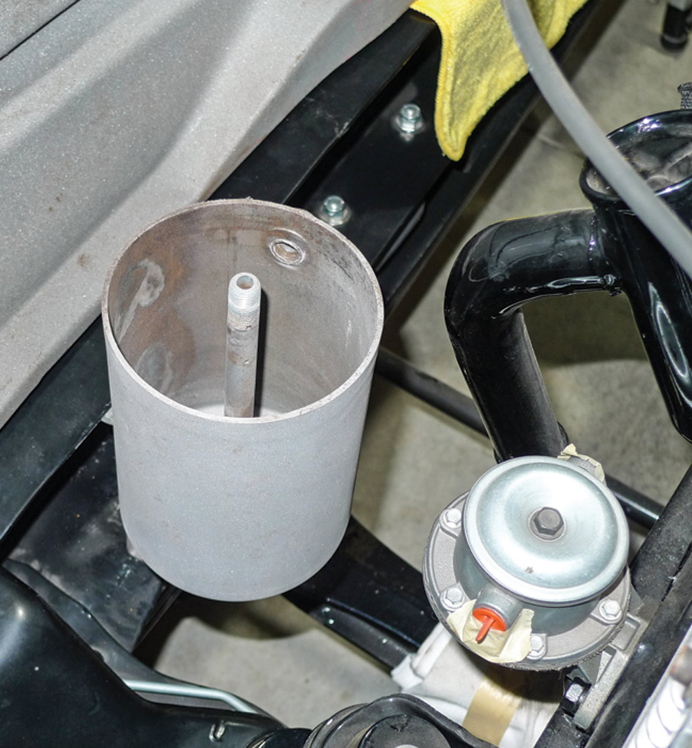 mechanic double-checks the fitment of the fender inner panel