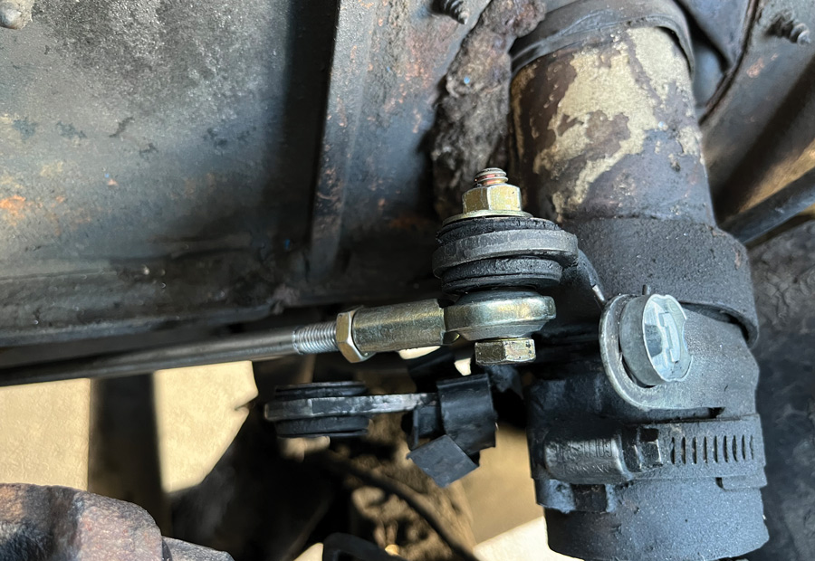 The rod was attached to the column as shown (the reverse lever was left intact, as it did not interfere with anything) and the column shifter secured in the park position …