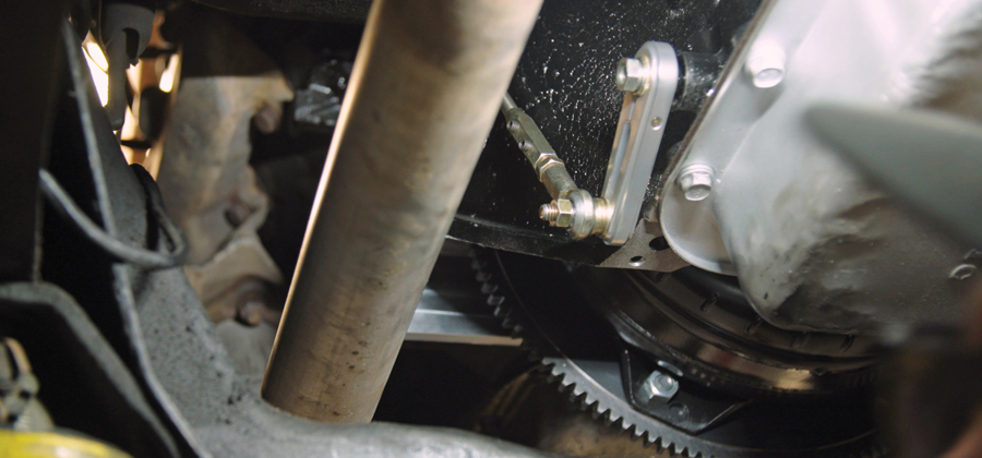 The supplied heim adjuster was installed along with the adjustable hex connector onto the newly formed shift rod, which was then attached to the transmission.