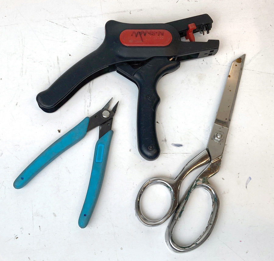 In addition to the proper crimping tools, a pair of good wire cutters, automatic wire strippers, and a sharp pair of metal scissors are indispensable to electrical work. 