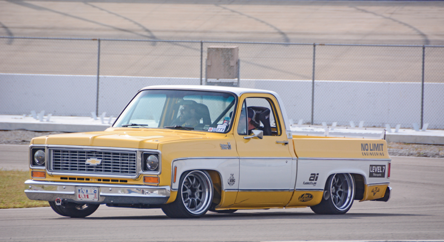 yellow ford truck with white stripe on the side