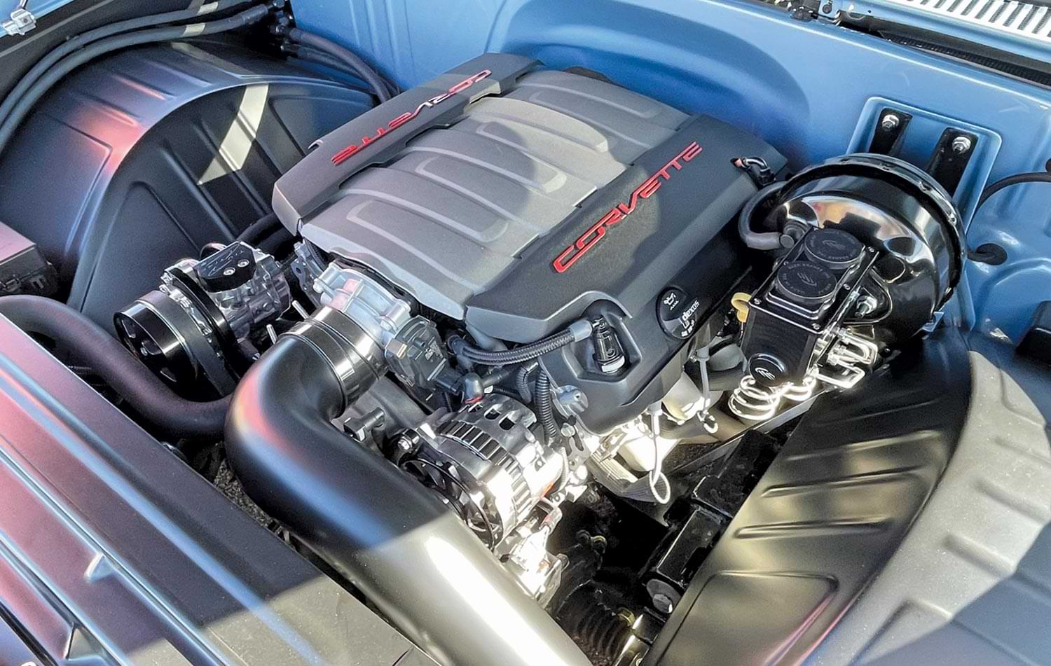 view of a Corvette engine under a hood