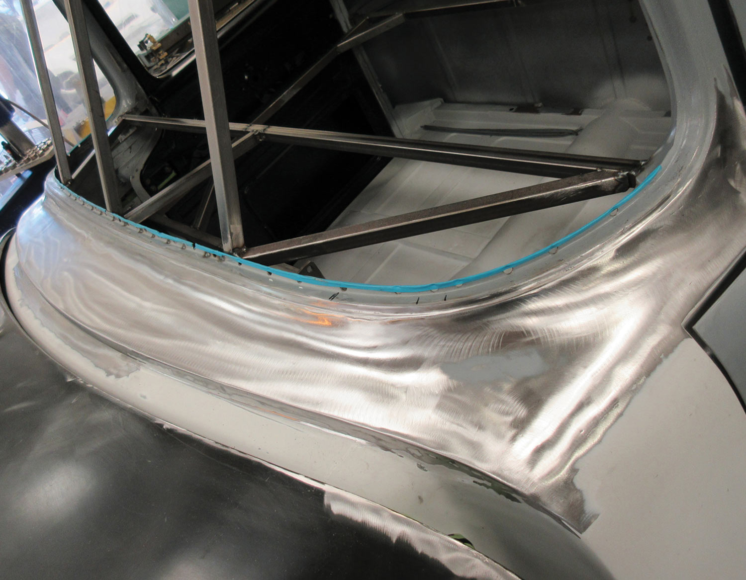 angled view of the re-shaped cowl, completely welded and metalfinished