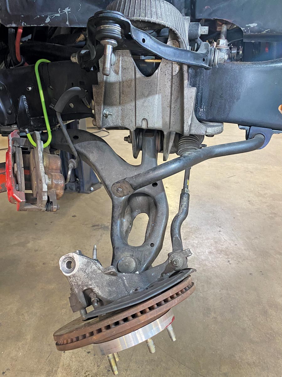Our tie rod/tie rod end remained attached to the spindle, so we’ll leave things hanging for just a bit while we tend to setting up the new coilover assembly.
