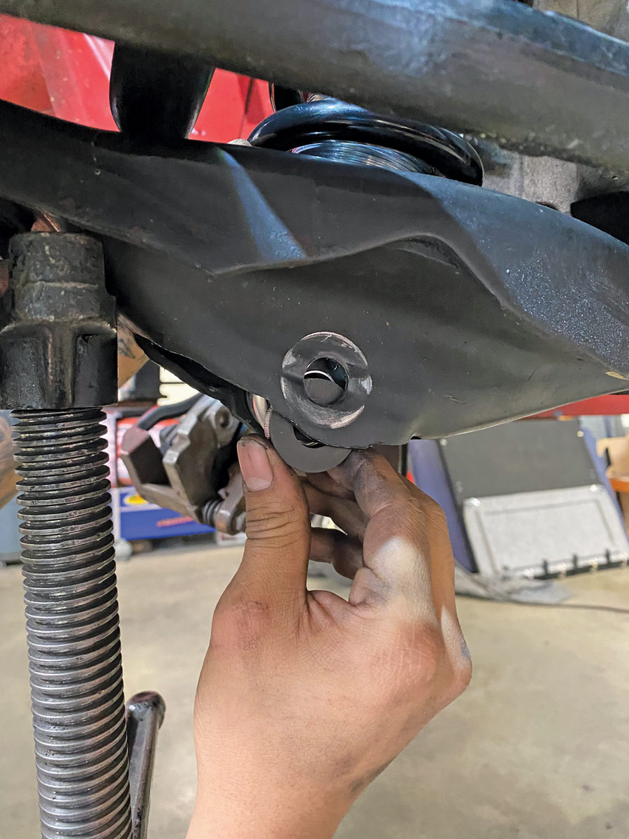 installing the OE lower shock bolt you saved along with the supplied spacers