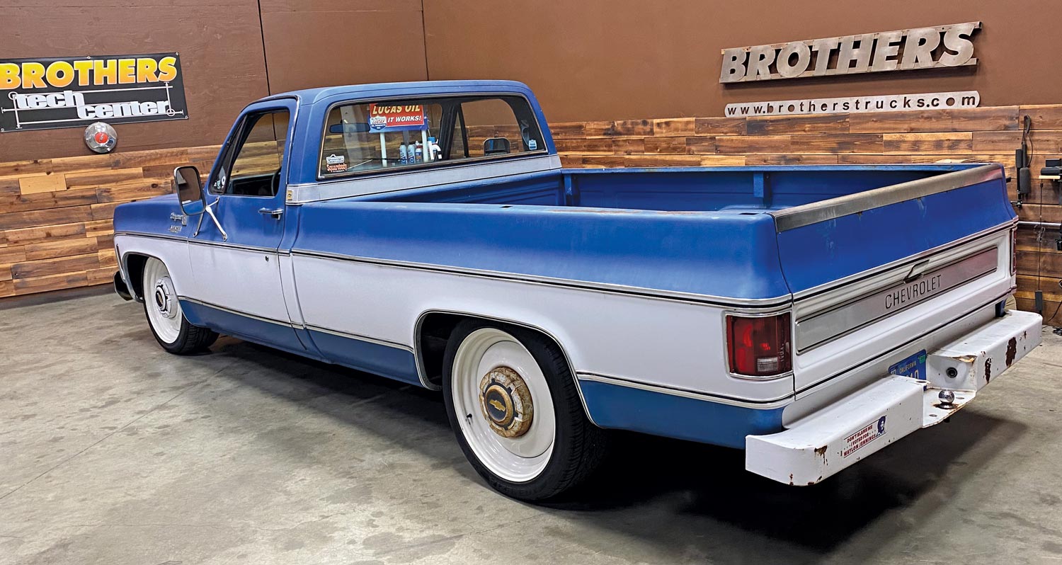 a blue Chevy truck with a longbed