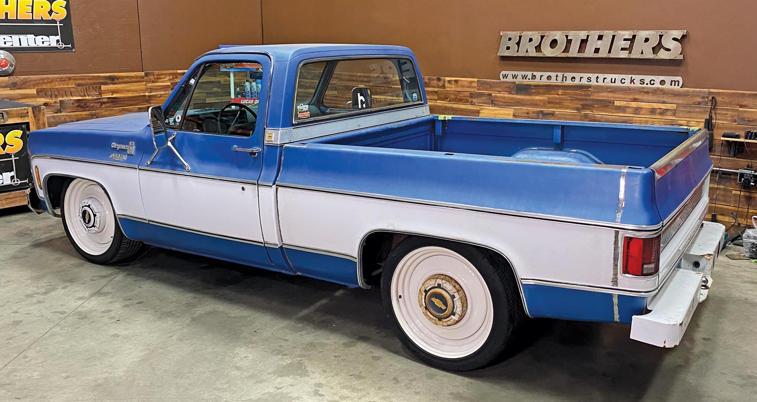 a blue Chevy truck with a shortbed