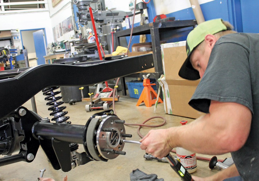 Here we see the rear coilovers and brake assemblies being installed on the rear axle. Axle options include 31- or 35-spline, depending on your horsepower rating.