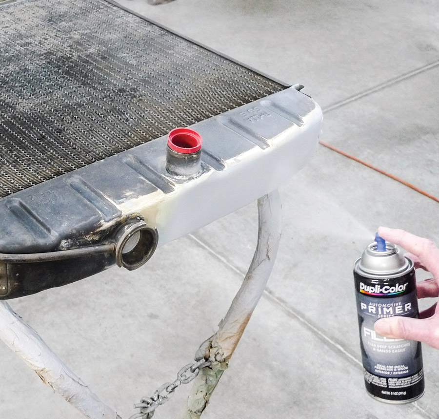 Now we can spot-prime the tank as necessary. Let’s also try skipping the ’gun-cleaning step. With aerosol Dupli-Color Filler Primer we’re thinking we might save some time. 