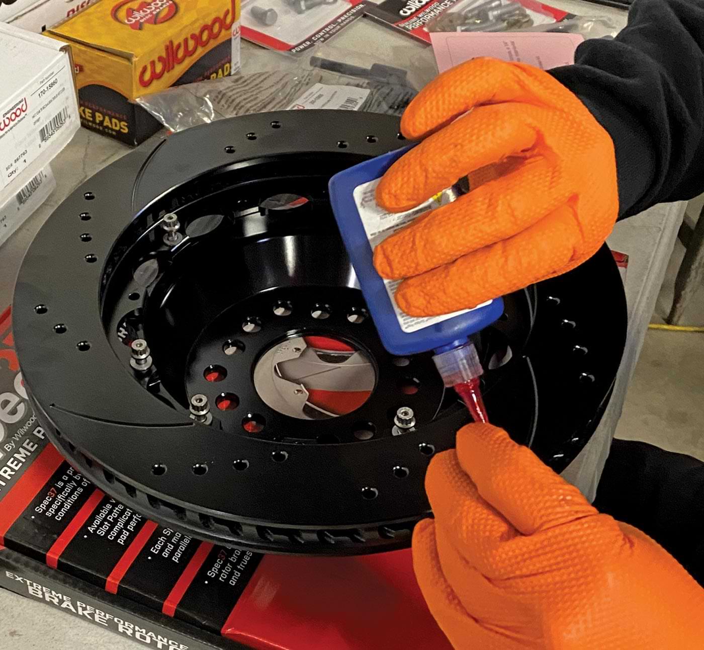 using red Loctite, the mechanic safety wires the rotor hardware