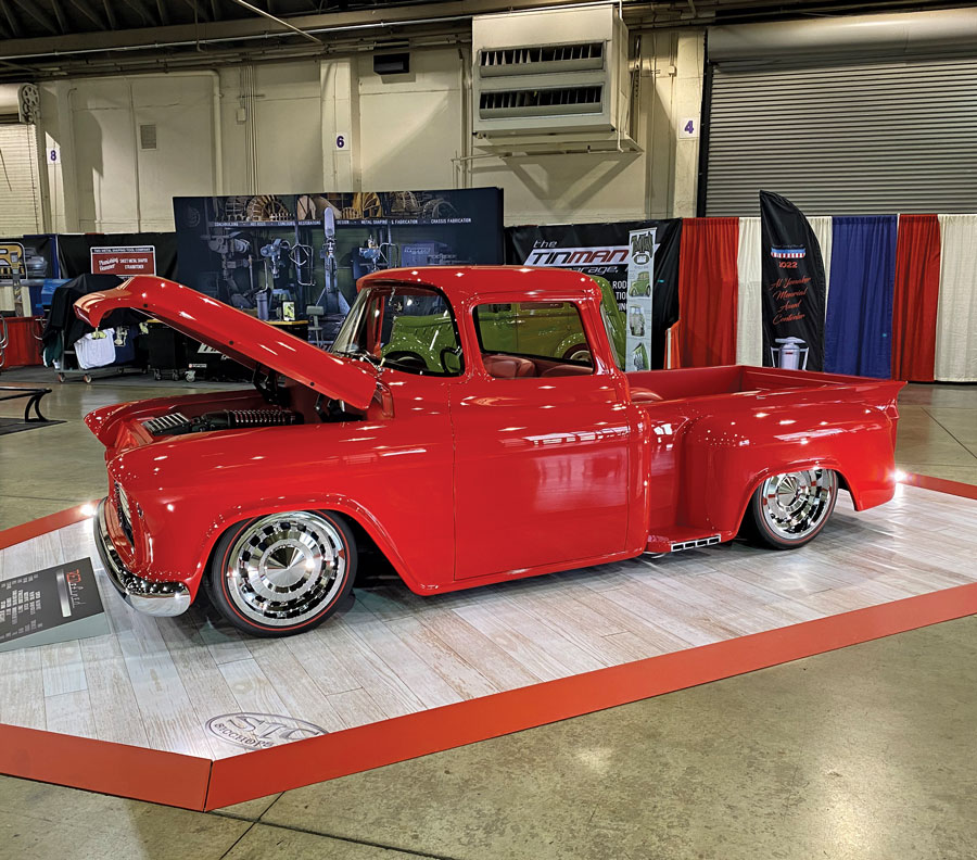 Red truck with raised hood