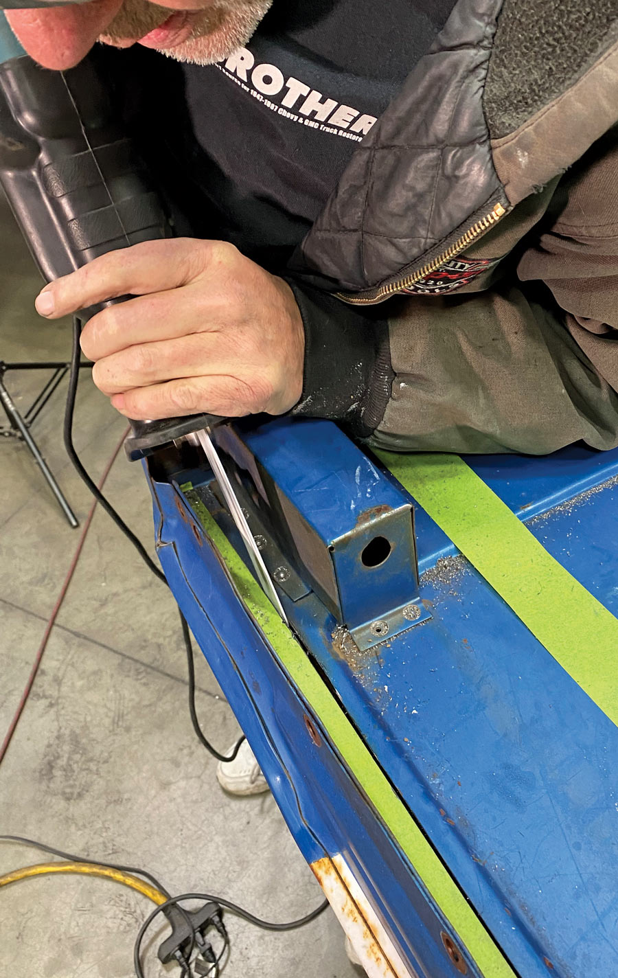 When you get toward the top, you’ll likely need to trade out your cutoff wheel for a Sawzall in order to get between the stake pocket and the front flange.
