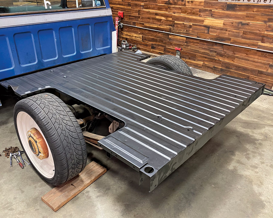 set our new ’73-87 SWB bed floor onto the shortened chassis—but left un-bolted
