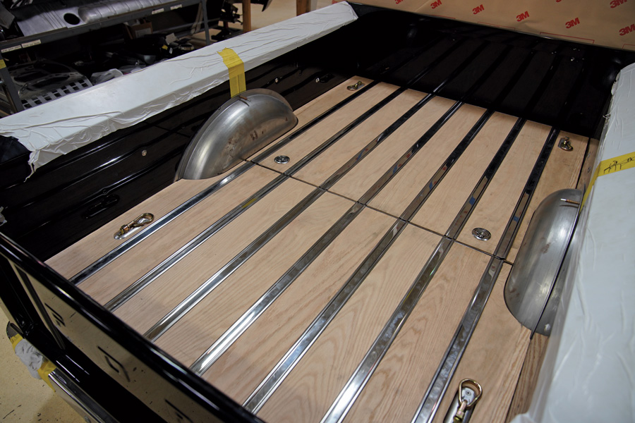 When the lids are closed the stainless steel rub strips overlap the adjacent wood planks hiding the openings.