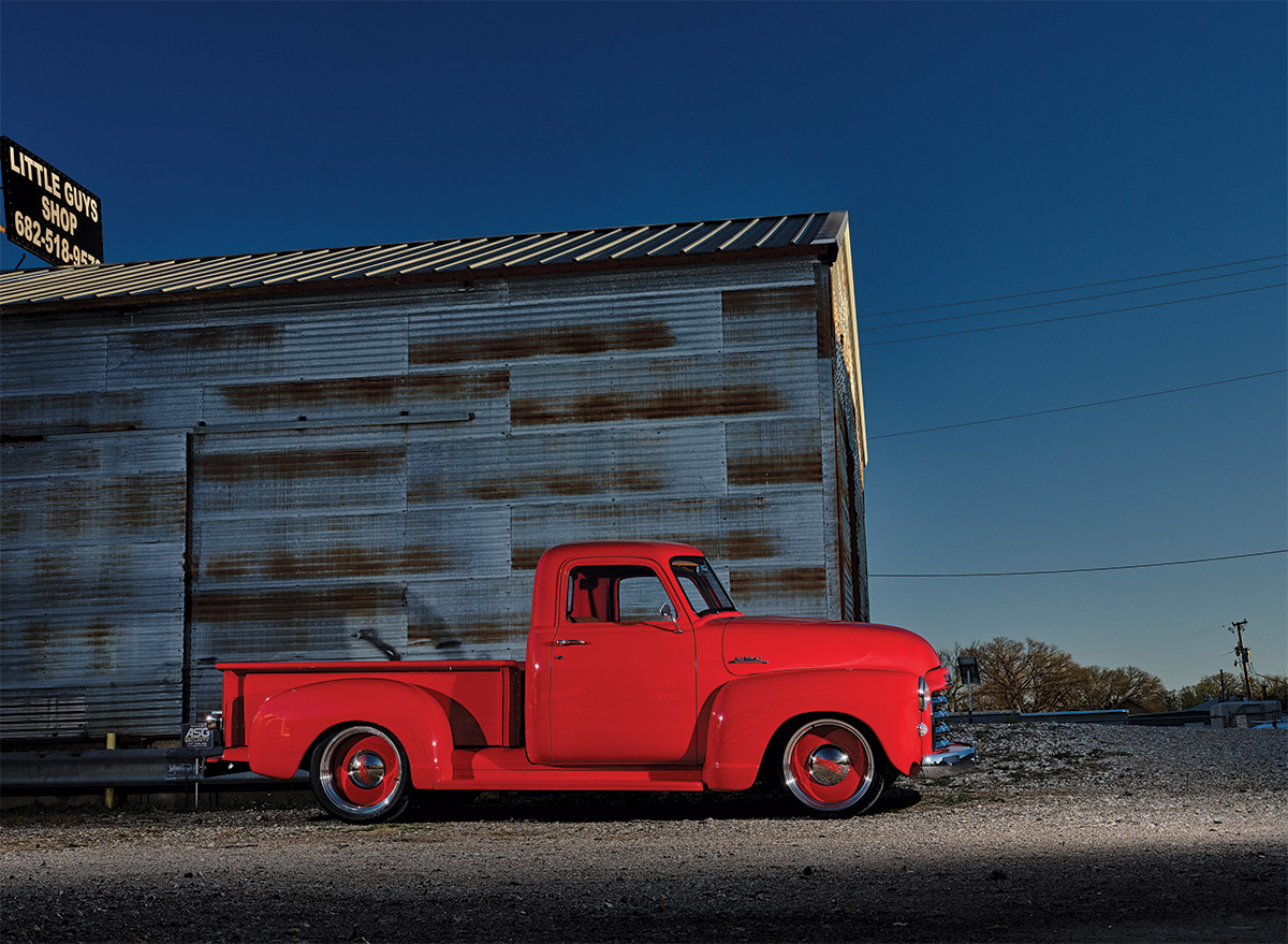 '49 GMC side profile in front of metal barn