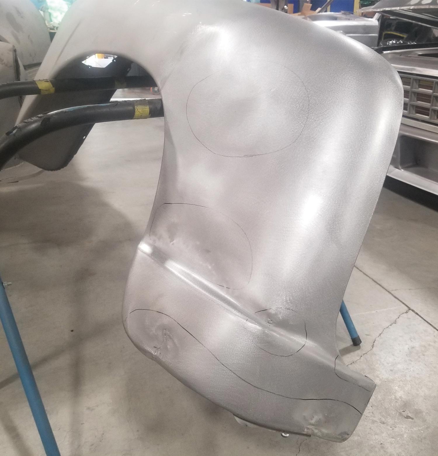 rear half of the driver side front fender with a freshly welded bottom area