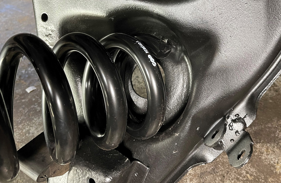We also used a 1-inch drop spring from CPP for a bit more drop in the front. Be sure to get the coil spring end to index with the upper spring pocket so it fits in position on the lower arm. As always, use care when installing coil springs!
